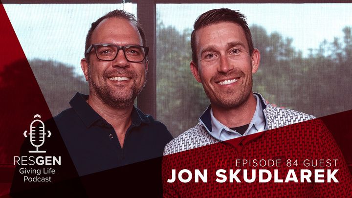 Tom and Jon standing together