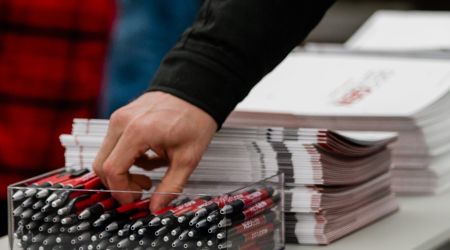 Computer and coffee on table