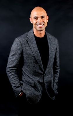 Man sitting and smiling on a chair