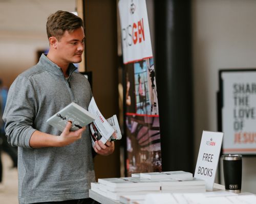 Computer and coffee on table